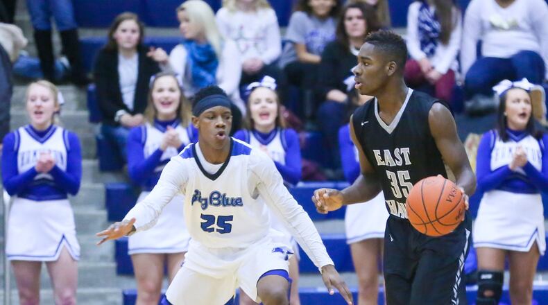 Lakota East guard Jarrett Cox (35) surveys the Hamilton defense during their game at the Hamilton Athletic Center on Feb. 10, 2017. GREG LYNCH/STAFF
