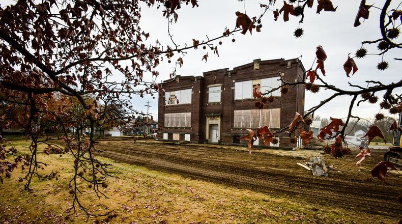 Crews continue demolition of the former Taylor School Thursday, Nov. 21, 2019 on Corwin Avenue in Hamilton. Members of a community organization had previously asked the city to help find options for the 110-year-old school, but it did not receive any proposals for redevelopment. NICK GRAHAM/STAFF