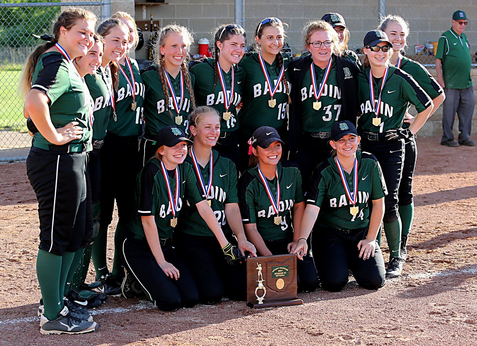 Badin’s softball team poses for photos Monday after defeating Clermont Northeastern 10-1 in a Division III district final at Kings. CONTRIBUTED PHOTO BY E.L. HUBBARD
