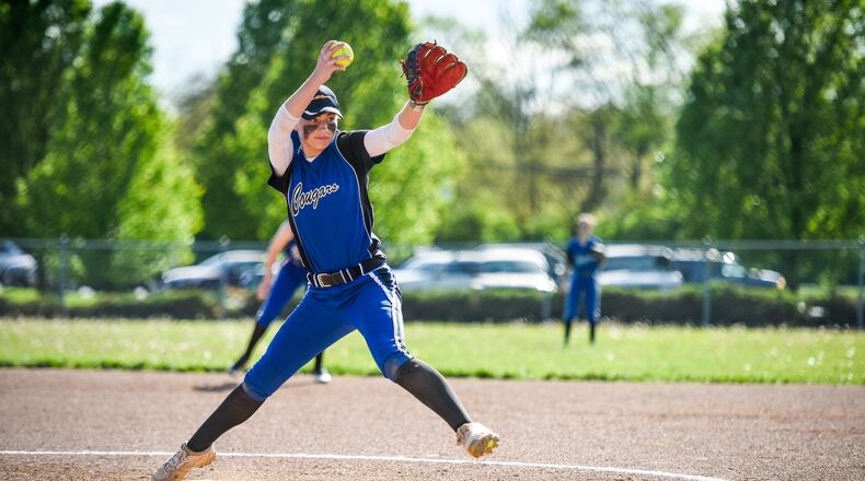 Cincinnati Christian’s Jenna Monk throws a pitch during a game at New Miami on April 24. CCS won 22-14. NICK GRAHAM/STAFF