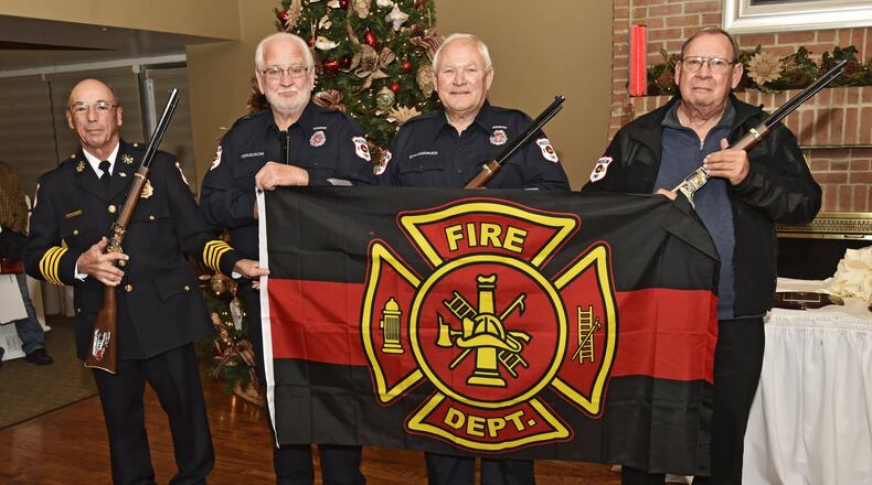 Four Madison Township firefighters were honored during their holiday dinner for 40 years of service each with the Madison Township Fire Department. Left to right, Deputy Chief Rife Denlinger, Denzil Ferguson, Bob Strassberger and Andy Bolen were recognized as firefighters of the year for 2017 and presented with plaques, flags and custom engraved rifles. The group pictured here represents 160 years of service to Madison Township. NICK GRAHAM/STAFF