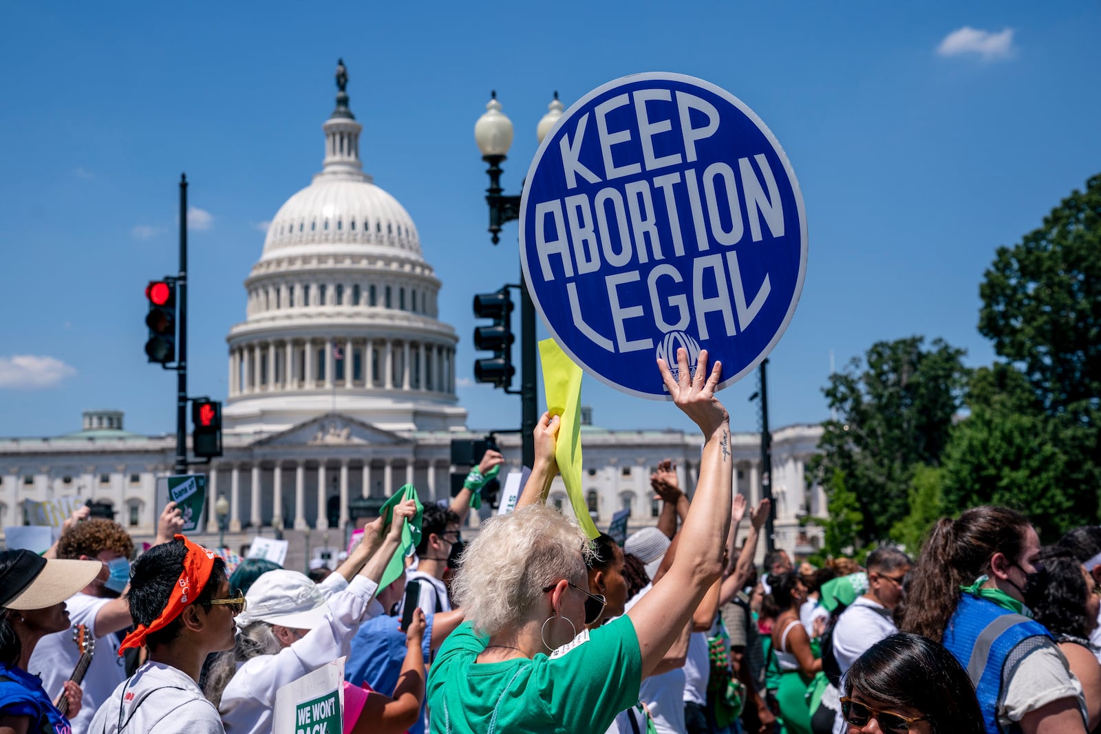 FILE - Abortion-rights activists demonstrate against the Supreme Court decision to overturn Roe v. Wade that established a constitutional right to abortion, on Capitol Hill in Washington, June 30, 2022. (AP Photo/J. Scott Applewhite, File)