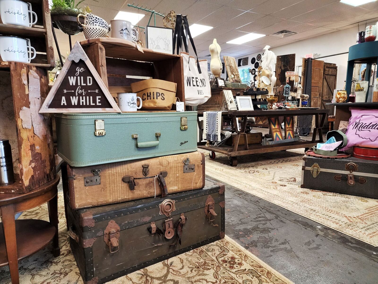 Iron Rose Mercantile and Shades of Chic cabinet painting have opened in a shared space in a renovated building on Ohio 122 in Madison Township. Lisa Dethlefs runs Iron Rose with an eclectic mix of decor, furniture, clothing, gifts, hats, jewelry and more and Susan Cox moved her Shades of Chic business in the back where she paints cabinets for customers. There is a collaborative space for classes, special events and more. NICK GRAHAM/STAFF
