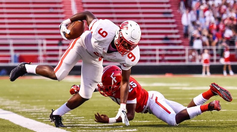 Fairfield’s Corey Smith (25) goes after Lakota West’s D.J. Christon on the sideline during Friday night’s 37-3 FHS victory at Fairfield Stadium. NICK GRAHAM/STAFF