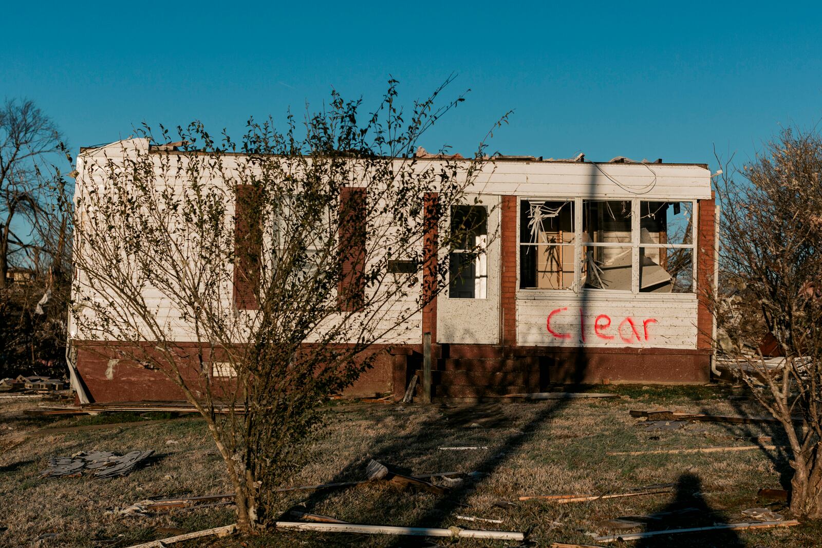 A structure in Dawson Springs, Ky., with blown out windows on Monday, Dec. 13, 2021, where a tornado flattened much of the town on Friday night. After grimly fluctuating death tolls since Friday’s devastating swarm of tornadoes, Gov. Andy Beshear of Kentucky said on Monday that there were 64 confirmed deaths in the state, though he expected that number to rise as crews continued to search through the ruins. (William Widmer/The New York Times)