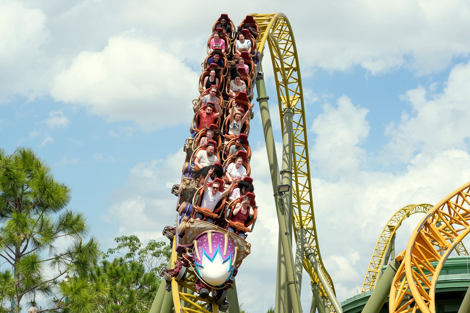 Guests ride on the Stardust Racers roller coaster at Epic Universe Theme Park at Universal Resort Orlando Thursday, April 10, 2025, in Orlando, Fla. (AP Photo/John Raoux)