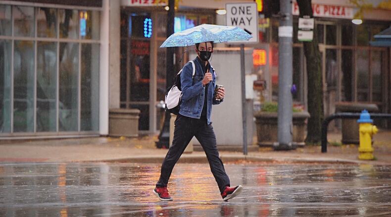 A Hurricane Zeta air mass brought heavy rain Thursday morning, Oct. 29, 2020, in downtown Dayton. MARSHALL GORBY\STAFF