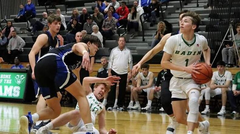 Badin’s Joseph Walsh (1) drives to the basket as teammate Zach Switzer (10) gets knocked to the ground during Tuesday night’s game against Springboro at Mulcahey Gym in Hamilton. Badin won 55-47. CONTRIBUTED PHOTO BY TERRI ADAMS