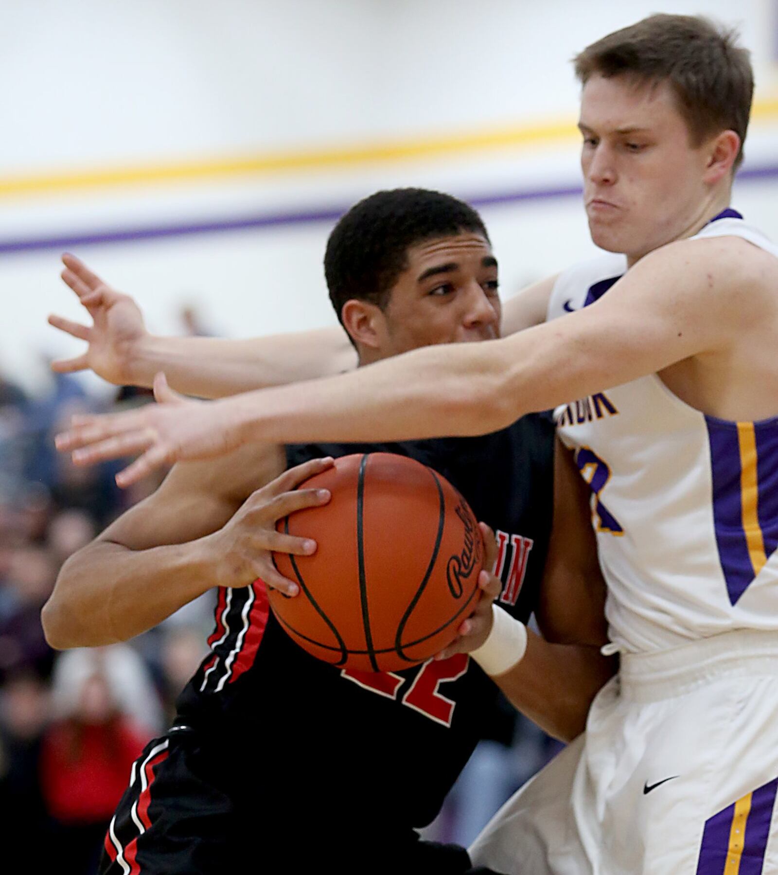 Franklin guard Ryan Montgomery is covered by Bellbrook forward Sean Ulrich on Friday night at Bellbrook. CONTRIBUTED PHOTO BY E.L. HUBBARD