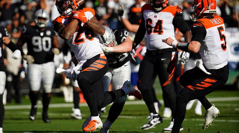 OAKLAND, CALIFORNIA - NOVEMBER 17: Joe Mixon #28 of the Cincinnati Bengals rushes for a touchdown during the first half against the Oakland Raiders at RingCentral Coliseum on November 17, 2019 in Oakland, California. (Photo by Daniel Shirey/Getty Images)