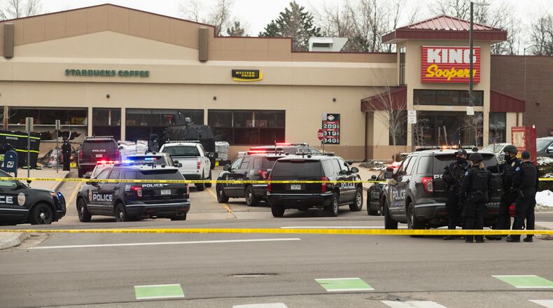 Police vehicles in the parking lot of the Boulder King Soopers grocery store after a shooting that killed multiple people in Boulder, Colo., on Monday, March 22, 2021. Ten people were killed on Monday when a gunman opened fire at the grocery store in Boulder, Colo., the authorities said. They included a Boulder police officer, a young grocery store worker and a retiree filling orders for Instacart. (Theo Stroomer/The New York Times)