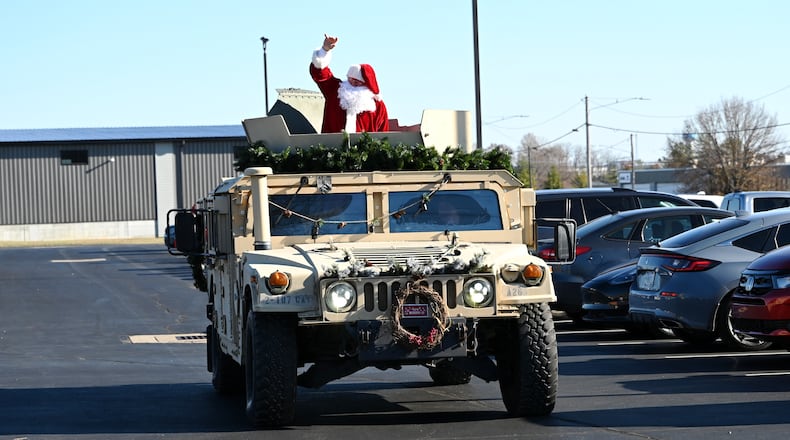 Santa Claus arrives at the Dec. 8, 2024, in a HMMWV at the National Guard Armory Christmas party for Delta Company and HHT at the Maj. Gen. Charles H. Jones National Guard Armory. MICHAEL D. PITMAN/STAFF