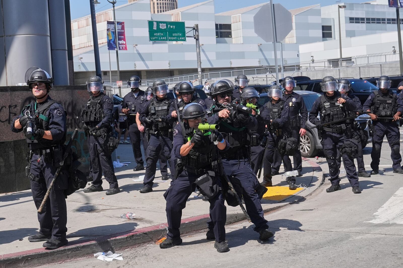 FILE - Police defend the Metropolitan Detention Center in downtown Los Angeles, Sunday, June 8, 2025, following last night's immigration raid protest. (AP Photo/Jae Hong, File)