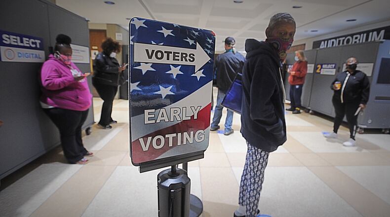 Long lines greeted voters at the Montgomery County Board of Elections on Tuesday, Oct. 6, 2020, as early voting began for the November general election. Early in-person voting in the state lasts until Nov. 2 and absentee ballots can be dropped off at the board office until Election Day, which is Nov. 3. In Montgomery County, registered voters can cast their ballot at the board of elections located at 451 W. Third St. in Dayton. MARSHALL GORBY/STAFF