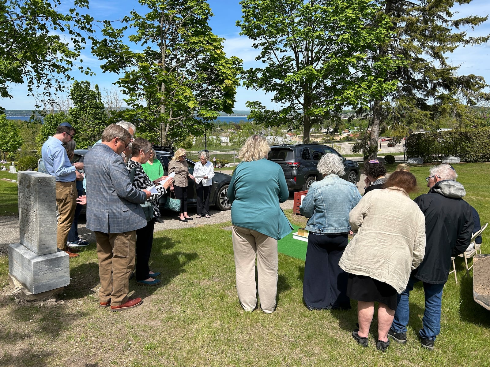 People gather at Greenwood Cemetery for the burial of Larry Rubin, former executive secretary of the Mackinac Bridge Authority, in Petoskey, Mich., Wednesday May 28, 2025. (Daniel Zivian via AP)