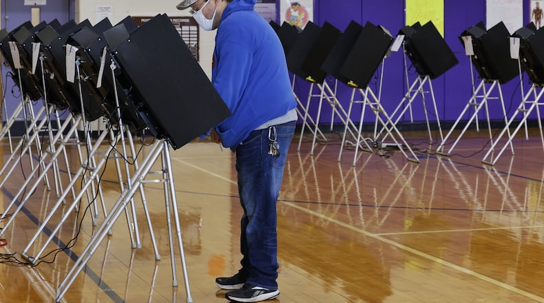 James Combs casts his ballot at Wildwood Elementary School on election day Tuesday, Nov. 2, 2021 in Middletown. NICK GRAHAM/STAFF
