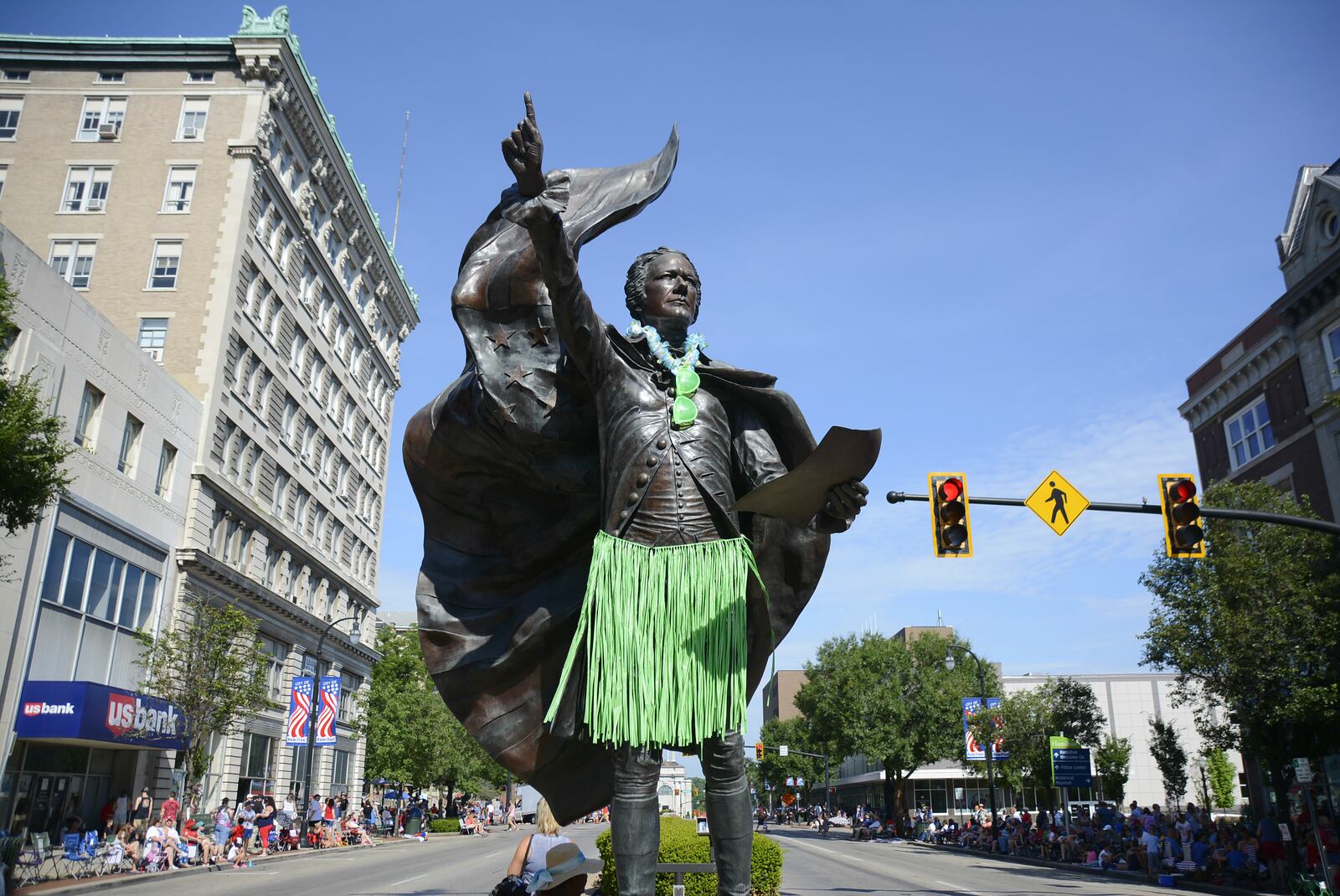 The statue of Alexander Hamilton on High Street was decorated in a green grass skirt, a lei and green shades for the Alive After 5 event on July 5.  MICHAEL D. PITMAN/STAFF