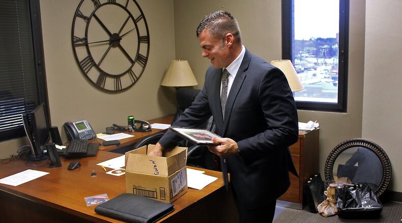 Andy Wilson packs up his office at the Clark County Prosecutor’s Office Thursday. Eric Higgenbotham/Staff