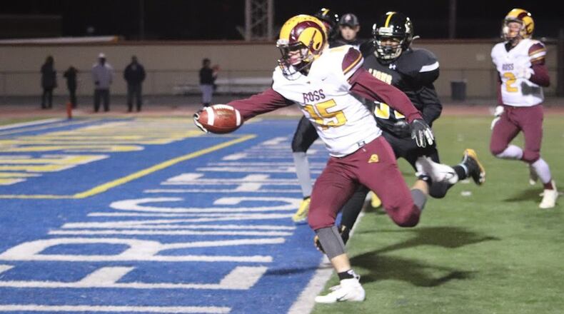 Dylan Caldwell (15) of Ross crosses the goal line for one of his four touchdowns Thursday night during a 52-6 victory over Meadowdale at Welcome Stadium in Dayton. CONTRIBUTED PHOTO BY KAREN REDEMEIER