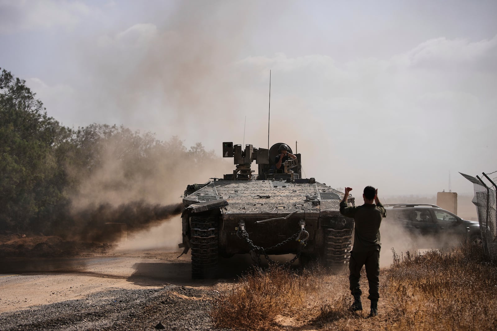 Israeli forces move along the border with the Gaza Strip, in southern Israel, Monday, May 19, 2025. (AP Photo/Ohad Zwigenberg)