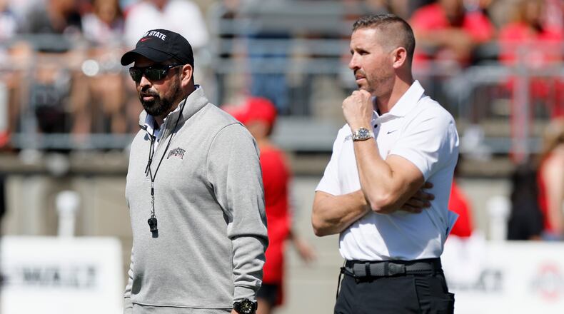 Ohio State head coach Ryan Day, left, and offensive coordinator Brian Hartline watch their team during their spring NCAA college football game, Saturday, April 15, 2023, in Columbus, Ohio. (AP Photo/Jay LaPrete)