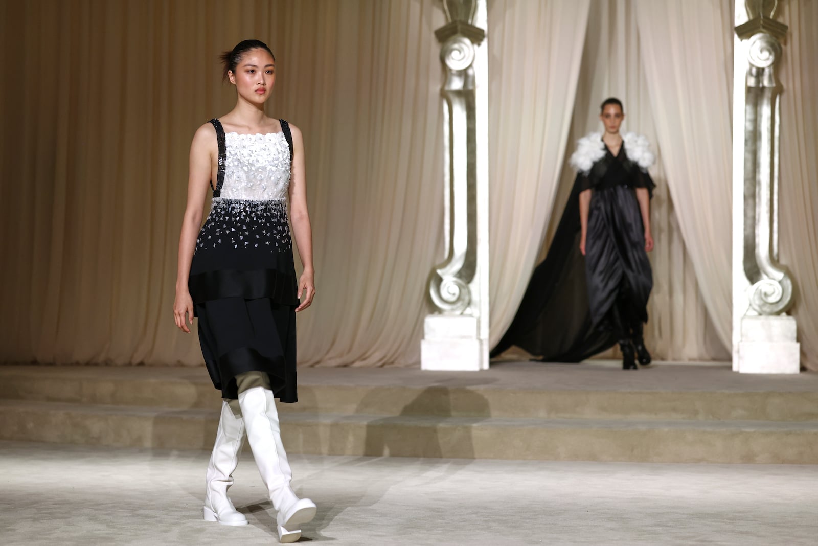 Models wear creations as part of the Chanel Fall-Winter 2025/26 Haute Couture collection presented Tuesday, July 8, 2025, in Paris. (AP Photo/Tom Nicholson)