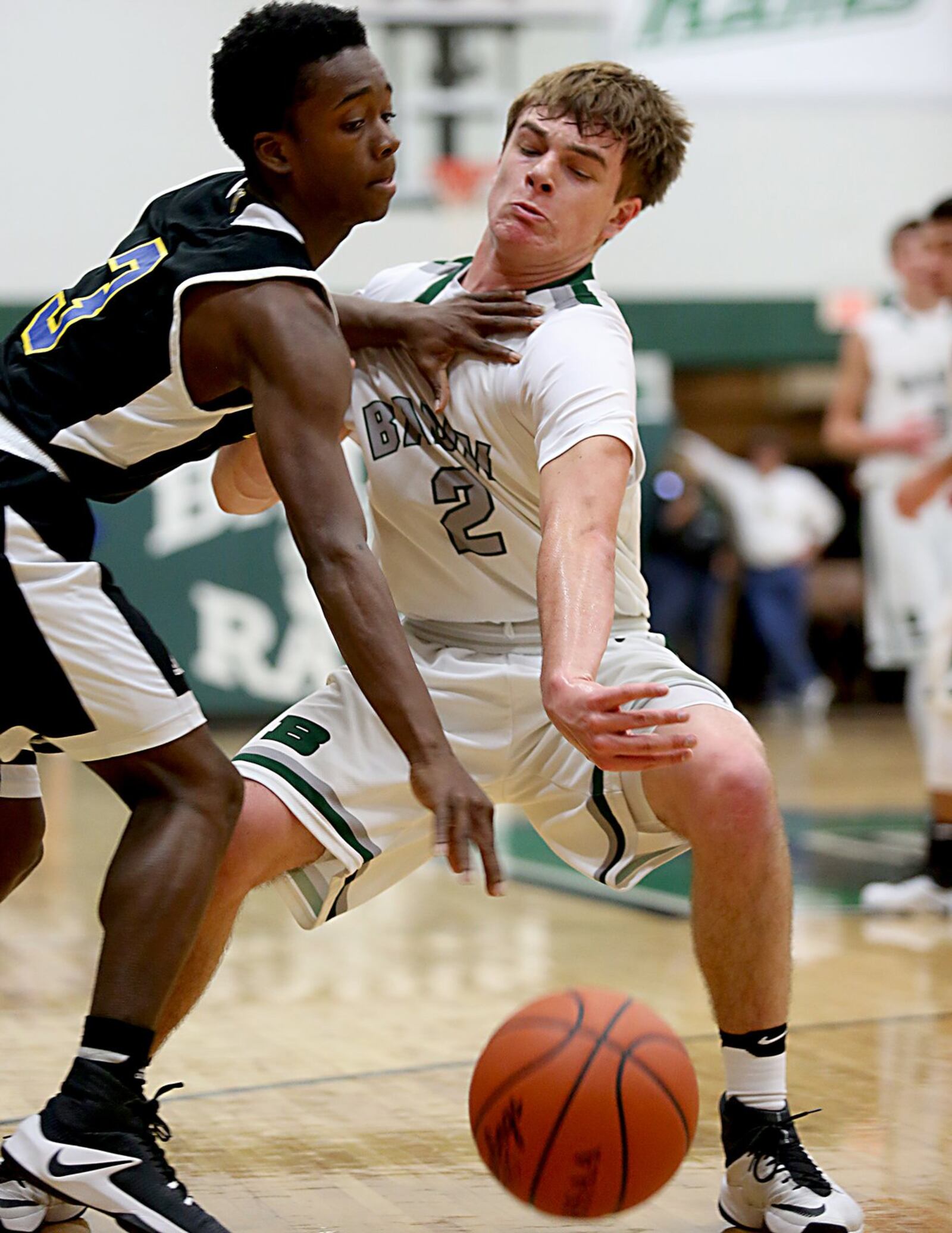 Northwest guard Jamique Dogan (left) and Badin guard Evan Grawe battle for the ball Wednesday night at Mulcahey Gym in Hamilton. CONTRIBUTED PHOTO BY E.L. HUBBARD