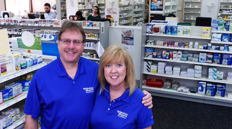 Pharmacist Kevin Berry and his wife Karen, director of pharmacy operations, are celebrating their 30th anniversary of serving the community in their Medicine Shoppe pharmacy on Central Avenue in Middletown and Middletown City Council plans to make a presentation to the business at council's Jan. 5 meeting. NICK GRAHAM/STAFF