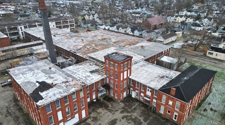 The $28 million Shuler and Benninghofen redevelopment project in the Hamilton neighborhood of Lindenwald is expected to receive historic tax credits this month. Owner Bloomfield Schon plans to invest $28 million to transform the building at the corner of Pleasant and Williams avenues ― just less than 2 miles from downtown Hamilton ― into a 100-unit apartment complex with commercial space. NICK GRAHAM/STAFF
