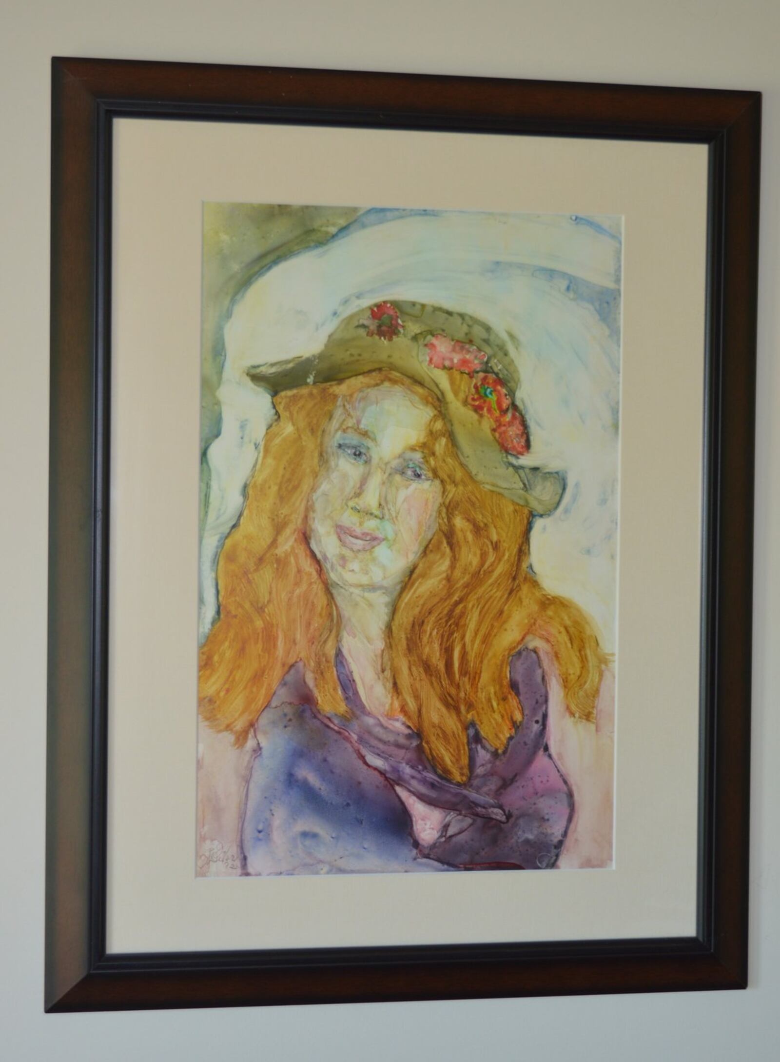 While most of her water color paintings are people and objects she can see and paint, this one of a young woman came completely out of her imagination. She was in my head. I just like her, E.J. DeVore said of the painting, which hangs in her living room. CONTRIBUTED/BOB RATTERMAN