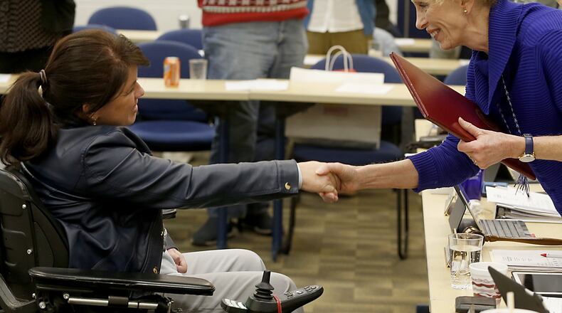 Kathy McMahon-Klosterman (right) received a proclamation from the Butler County Commissioners, presented by Shawna Noble Smith. McMahon-Klosterman was praised for her 12 years of service to the Butler County Board of Developmental Disabilities.