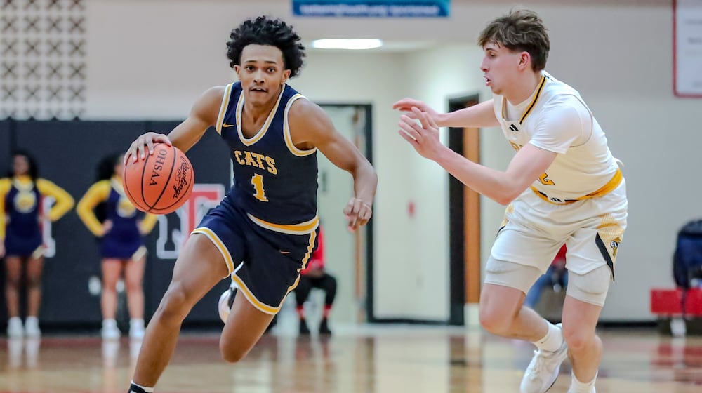 The Centerville High School boys basketball team beat Springfield 63-45 in a Division I district semifinal game on Tuesday, Feb. 26, at Trotwood Madison High School. MICHAEL COOPER/STAFF PHOTO