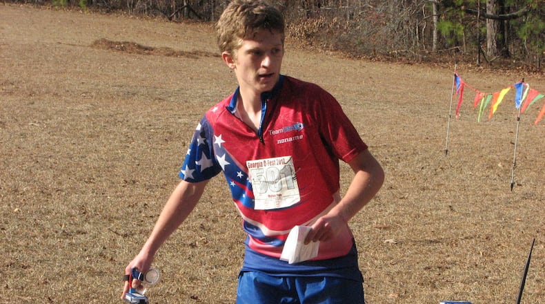 USA Junior National Team Member Dylan Poe (of Liberty, Indiana) visits a control point at a previous January Orienteering event. SUBMITTED PHOTO