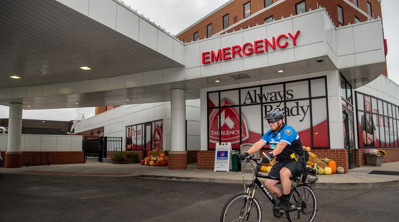 Officer Jordan Schenck, of Kettering Health Network Police at Fort Hamilton Hospital, patrols the area around the hospital Tuesday, Oct. 29, 2019. The health network last month added a bike patrol to the police force it installed at the facility earlier this year. CONTRIBUTED