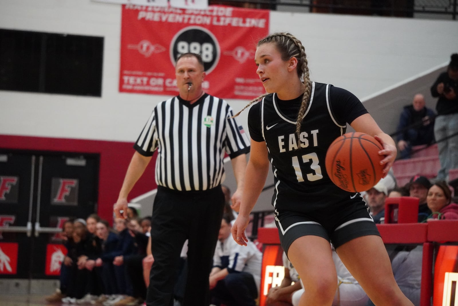 Lakota East's Payton Buker dribbles the ball up court during her Division I district semifinal game against Walnut Hills on Monday night at Fairfield Arena. CHRIS VOGT / CONTRIBUTED