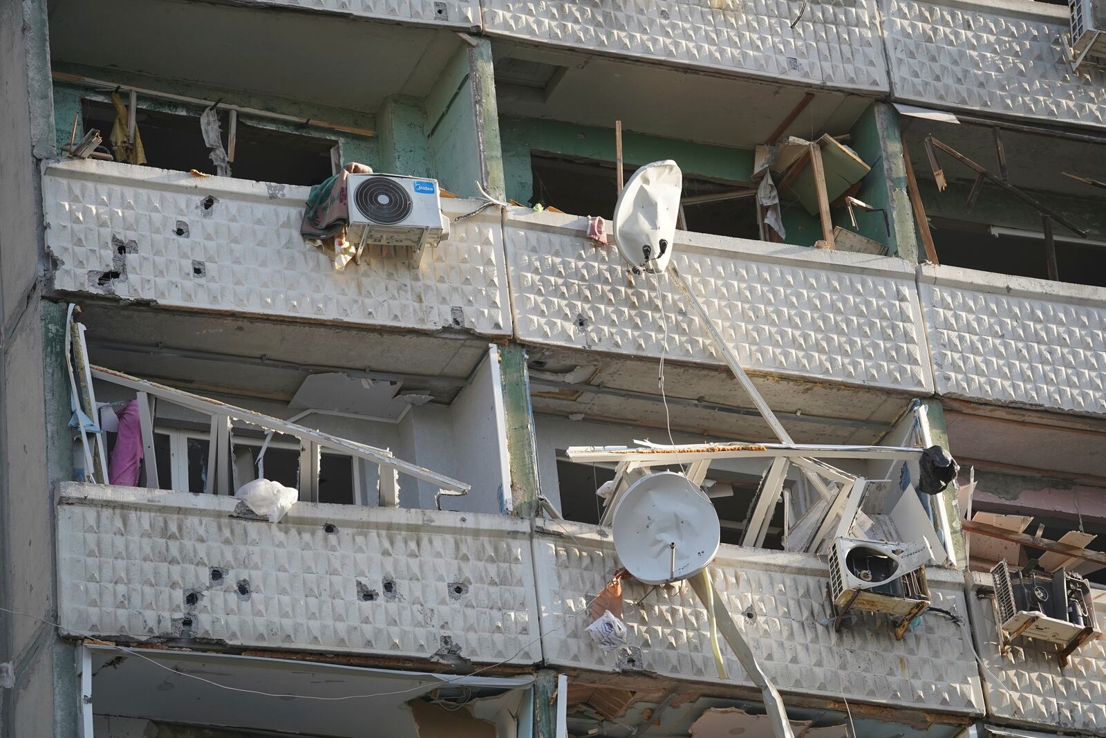 A residential building damaged by a Russian strike in Kharkiv, Ukraine, Friday April 18, 2025. (AP Photo/Andrii Marienko)