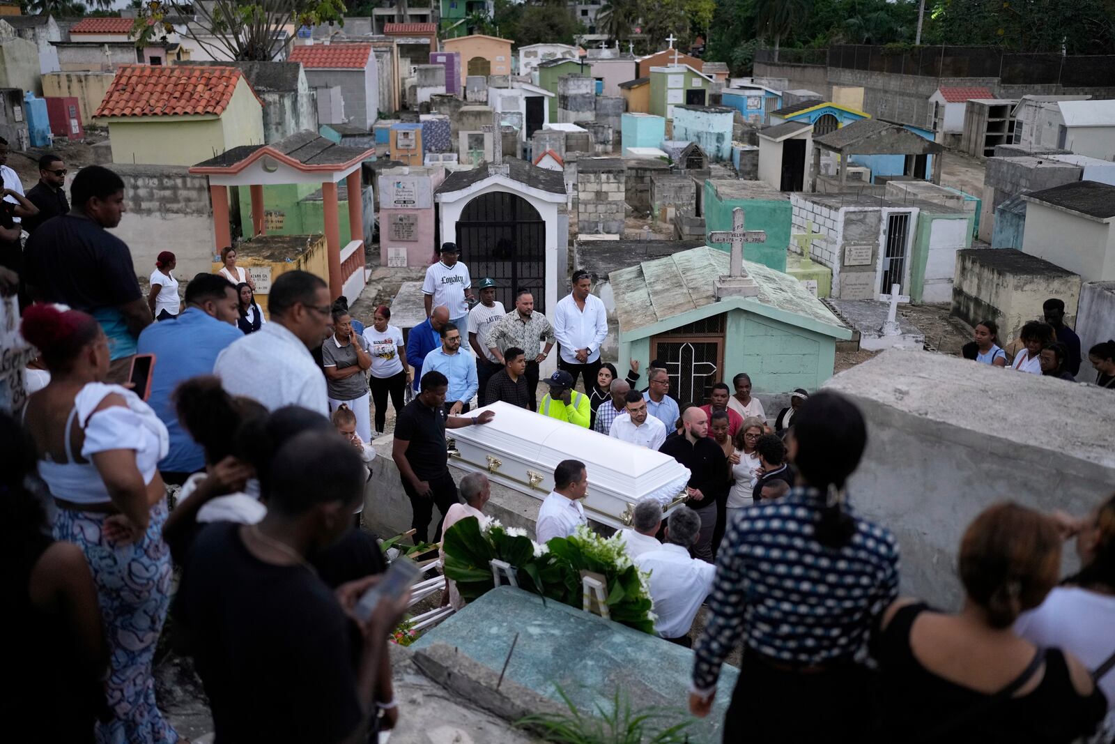 Family and friends attend the funeral of Marilenny Pilarte who died at the Jet Set nightclub when its roof collapsed, in Haina, Dominican Republic, Thursday, April 10, 2025. (AP Photo/Matias Delacroix)
