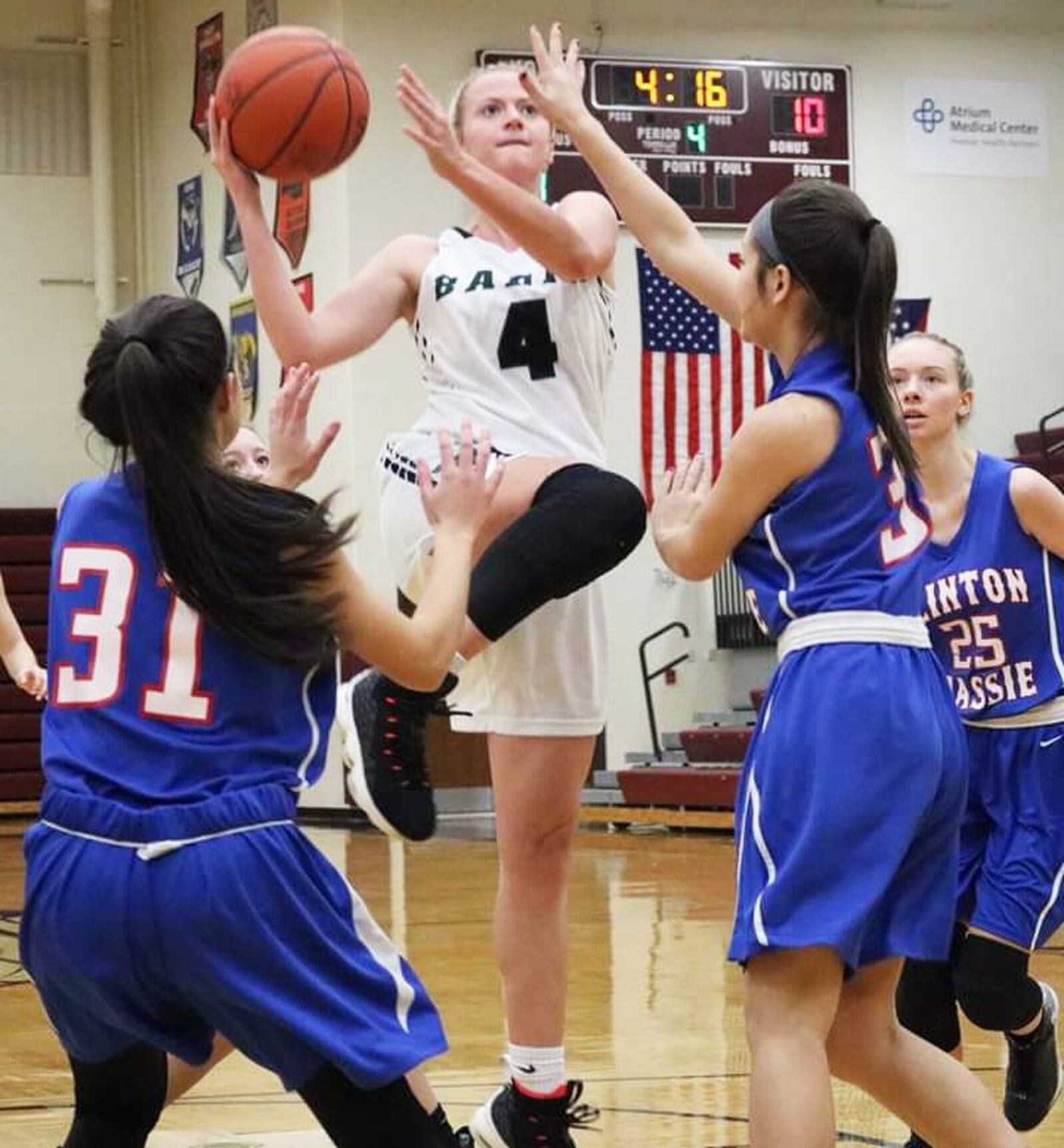 Badin’s Kelly Havens (4) goes up for a shot in the middle of Clinton-Massie’s defense Saturday afternoon during a Division II sectional opener at Lebanon. Badin won 54-10. CONTRIBUTED PHOTO BY TERRI ADAMS