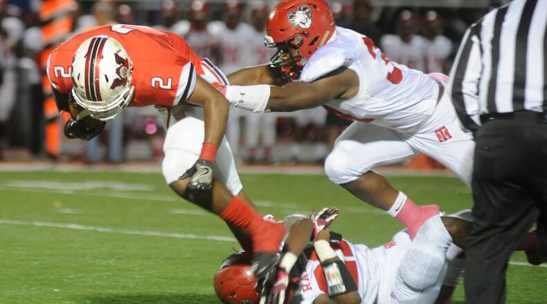 Wayne’s Fred Pitts (2) makes a short gain during Thursday’s 17-6 defeat of visiting Trotwood-Madison. Top-seeded Wayne will host Lancaster in the first round of the D-I, Region 3 high school football playoffs on Friday and Trotwood is at Wapakoneta in the D-III, Region 12 first round on Saturday. MARC PENDLETON / STAFF