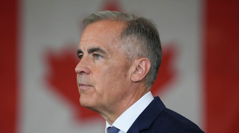 Canada's Prime Minister Mark Carney delivers a statement at the Walters Group Steel fabrication plant in Hamilton, Ont., Wednesday, July 16, 2025. (Chris Young/The Canadian Press via AP)