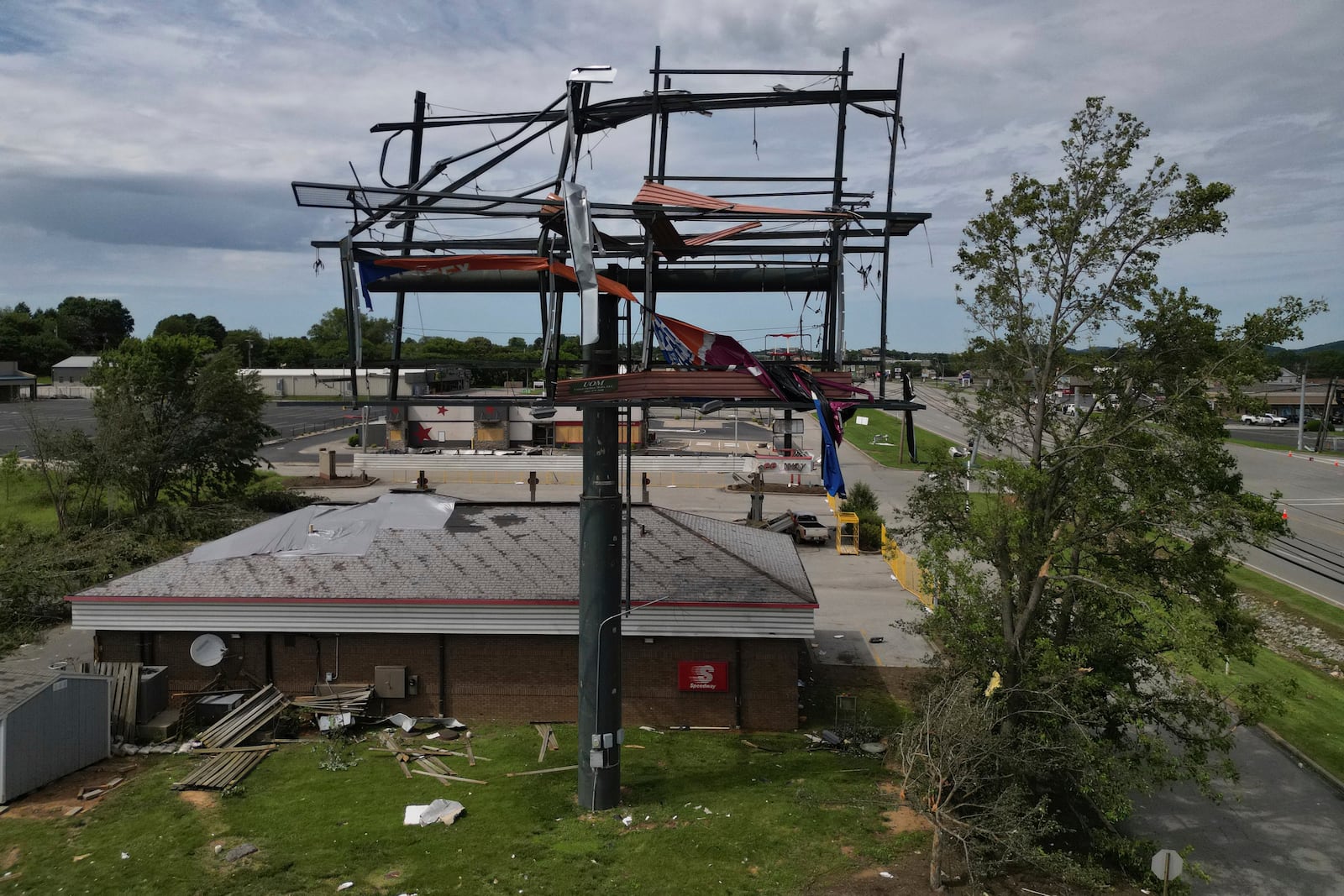 A billboard and Speedway gas station are damaged, Sunday, May 18, 2025, along Highway 27 in Somerset, Ky., after a severe storm passed through the area. (AP Photo/Carolyn Kaster)