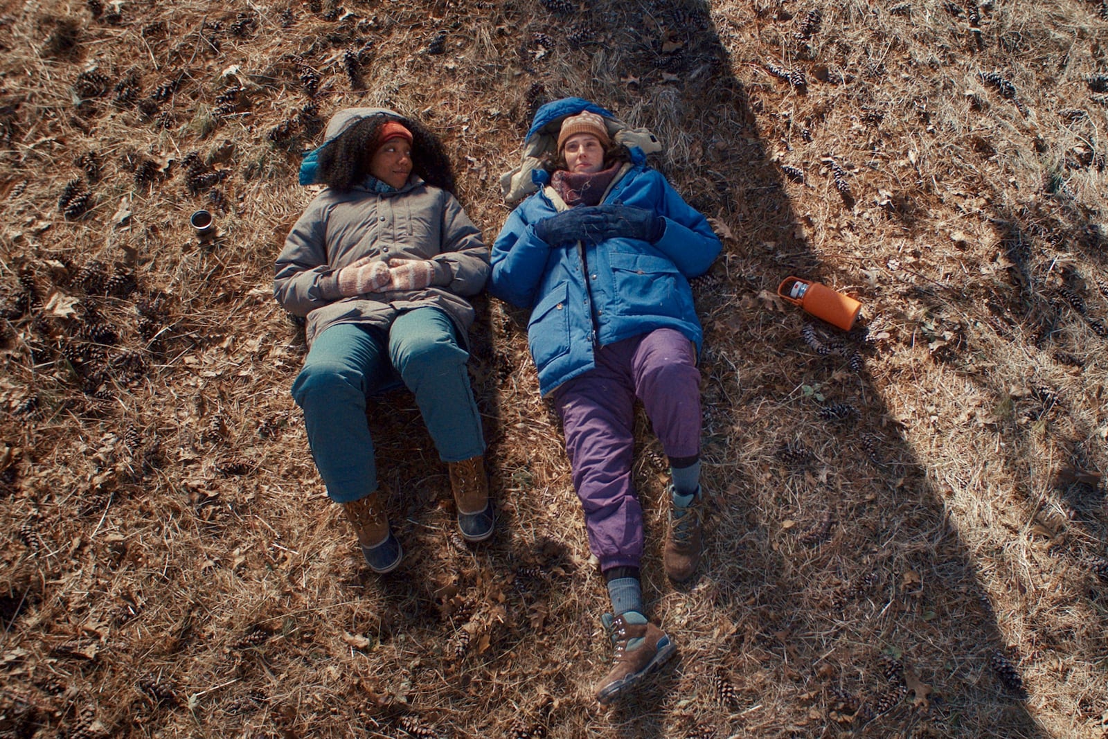 This image released by A24 shows Naomi Ackie, left, and Eva Victor in a scene from "Sorry, Baby." (A24 via AP)