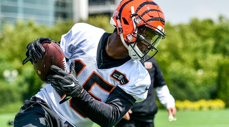 Wide receiver John Ross catches a pass during the first day of Cincinnati Bengals Training Camp Friday, July 28 at the practice fields beside Paul Brown Stadium in Cincinnati. NICK GRAHAM/STAFF
