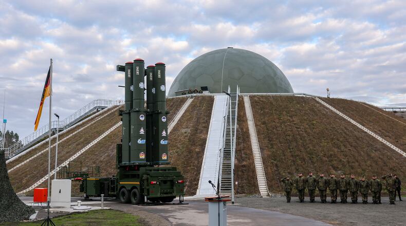 The launcher of the new Arrow 3 missile defense system stands in front of the radome in Annaburger Heide, Germany, Wednesday, Dec. 3, 2025. (Jan Woitas/dpa via AP)