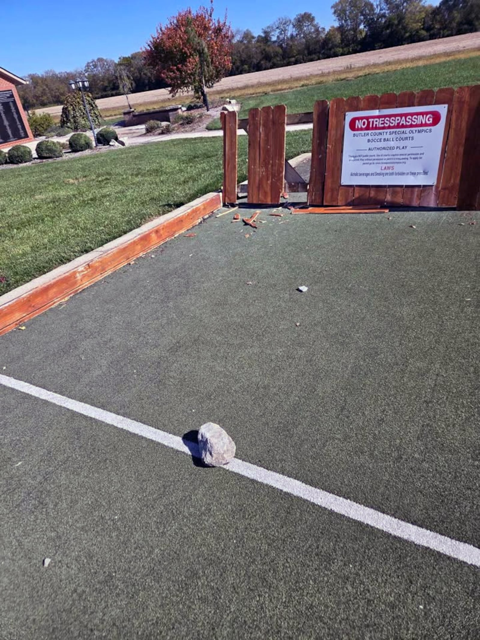 A fence at the end of the bocce ball court at the Joe Nuxhall Miracle League Fields complex was damaged over the weekend. Rocks were discovered near the damage. Security footage showed teens vandalizing the fence. CONTRIBUTED