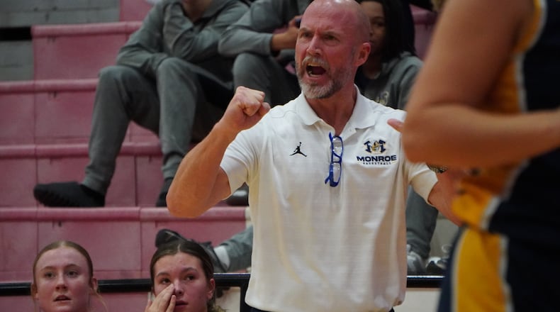Monroe girls basketball coach Jason Frazier cheers on his Hornets during a recent game against Cincinnati Christian on Saturday at Fairfield Arena. CHRIS VOGT / CONTRIBUTED