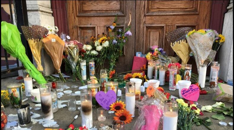 Makeshift memorial in front of Ned Peppers in the Oregon District.