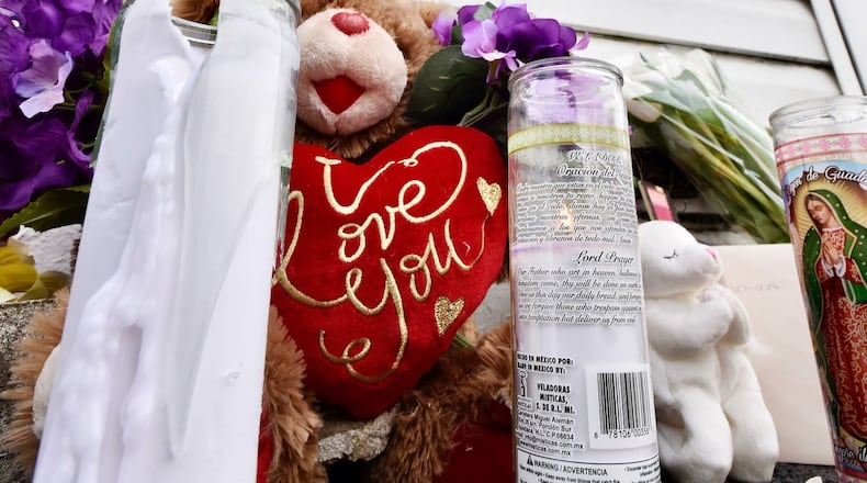 A sign and flowers were dropped off at Middletown Transmission, the business that Archie Cheesman owned on Crawford Street. Cheesman died from injuries sustained in a two-vehicle crash Feb. 2 while driving a bus for the Franklin First Church of God. NICK GRAHAM / STAFF