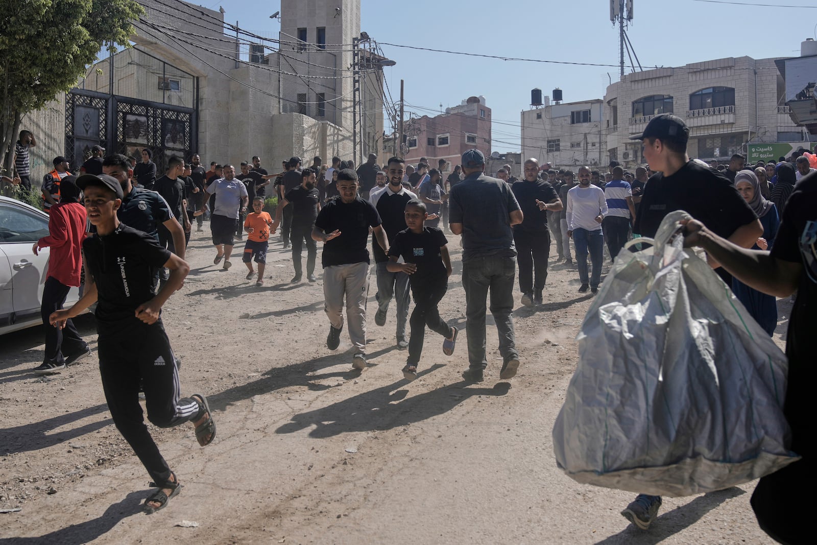 Palestinians gather their belongings ahead of homes demolition by Israeli forces in the Tulkarem refugee camp, West Bank, Wednesday, July 2, 2025. (AP Photo/Majdi Mohammed)