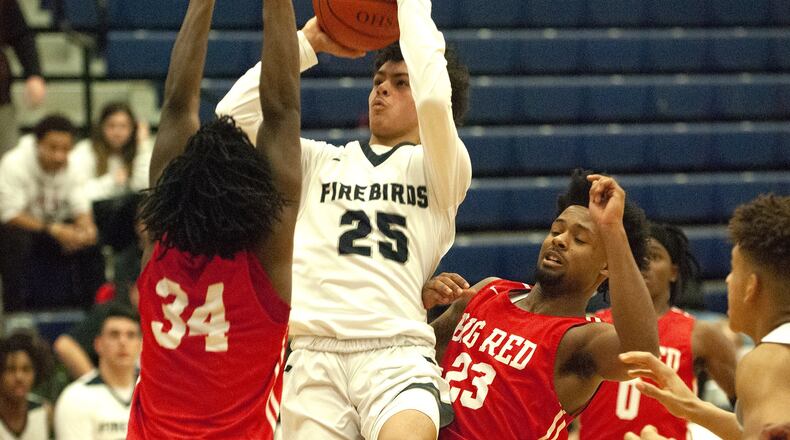 Fairmont sophomore Malachi Parker pulls up in the lane for the game-winning basket with 15 seconds left to lift the Firebirds to a 48-46 victory over Cincinnati Hughes on Monday in the final game of Flyin’ To The Hoop at Trent Arena. Jeff Gilbert/CONTRIBUTED